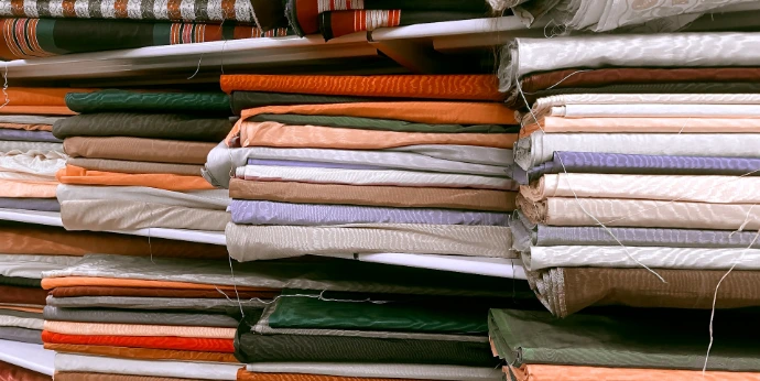 a pile of folded clothes sitting next to each other