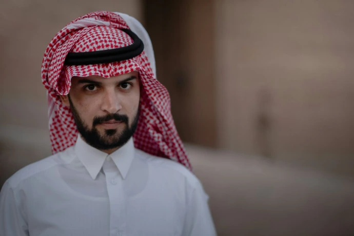 man in white dress shirt wearing red and white hijab
